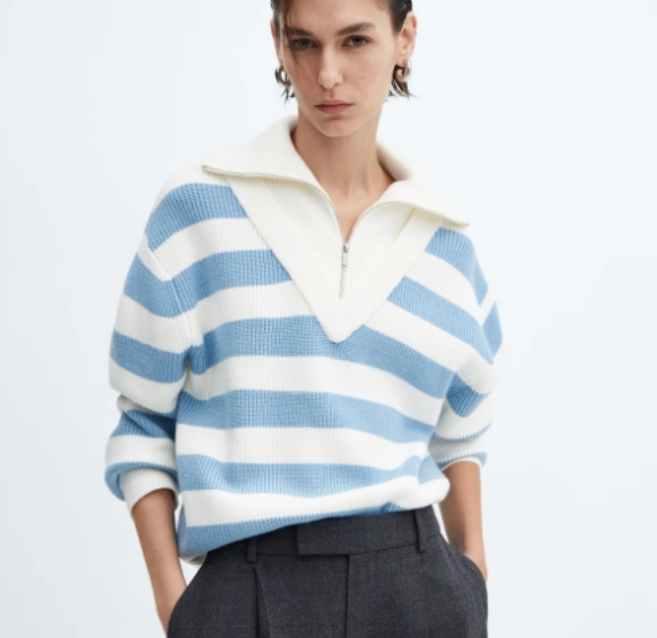 a low v neck knitted top in white and light blue stripes currently on sale at 50% off from mango