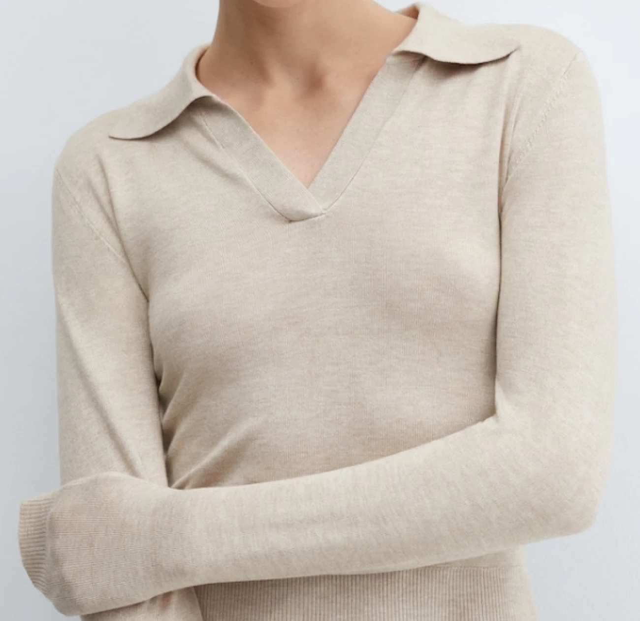 Knitted polo neck sweater with a plunging neck and a crop in light beige is currently on sale from the mango store at 50% off